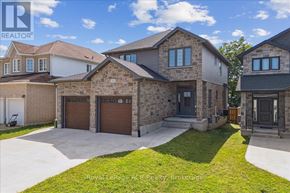 Owen Sound apartment for rent - A large, modern house with a driveway in front.