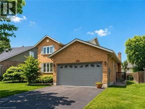 Guelph apartment for rent - A two-story house with a garage and a driveway.