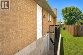 Guelph apartment for rent - A house with a Realty sign on the wall.