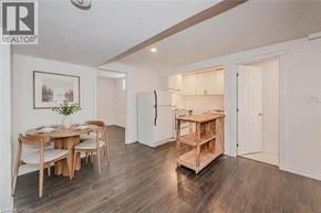 Guelph apartment for rent - A dining room with a wooden table and chairs.