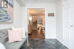 Milton (Tm Timberlea) apartment for rent - A hallway with a bench and a painting on the wall.