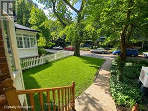 Toronto (Annex) apartment for rent - A tree-lined street with cars parked on the side.