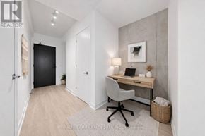 Toronto (Moss Park) condo for rent - A home office with a desk, chair, and laptop.
