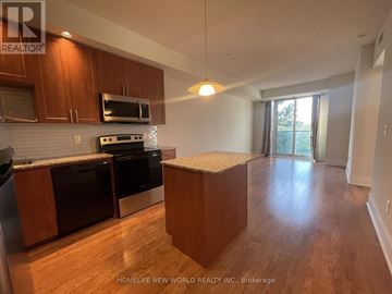 Toronto (Banbury-Don Mills) condo for rent - A kitchen with wooden cabinets and a white countertop.