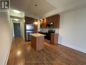 Toronto (Banbury-Don Mills) condo for rent - A kitchen with wooden floors and a white ceiling.