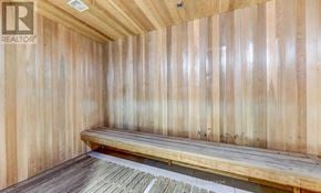 Toronto (Waterfront Communities) condo for rent - A wooden sauna with a bench inside.