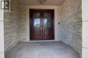 Mississauga (Lorne Park) apartment for rent - A double door with a glass window is set in a stone wall.