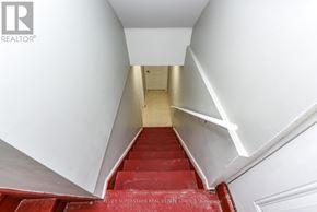 Brampton (Fletcher's Creek Village) apartment for rent - A staircase with red steps and white walls.