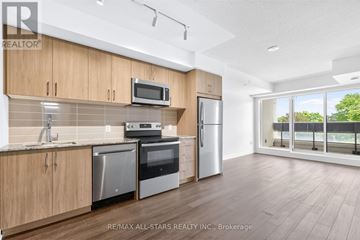 Toronto (Humber Heights) condo for rent - A kitchen with wooden cabinets and stainless steel appliances.