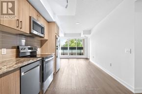 Toronto (Humber Heights) condo for rent - A kitchen with wooden cabinets and stainless steel appliances.