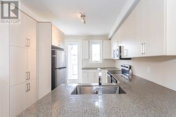 London North (North M) townhouse for rent - A kitchen with a sink and cabinets.