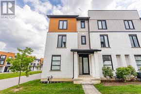 London North (North M) townhouse for rent - A modern two-story house with a front yard and a tree.
