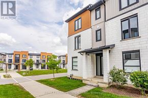 London North (North M) townhouse for rent - A modern apartment complex with a clear sky in the background.
