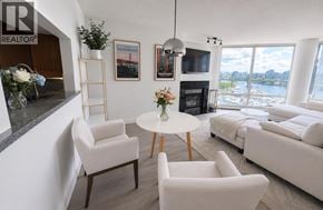 Vancouver apartment for rent - A living room with a fireplace and a view of the water.
