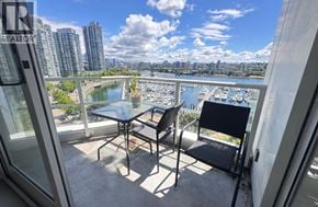 Vancouver apartment for rent - A balcony with a table and chairs overlooking a river.