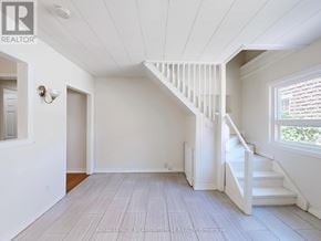 Halton Hills (Georgetown) multi-family for rent - A white room with a staircase and a window.