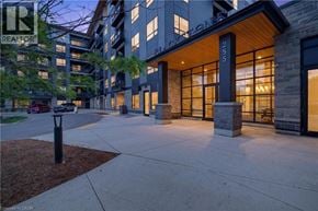 Waterloo condo for rent - A modern building with a glass entrance and a sign that reads "STUDIO".