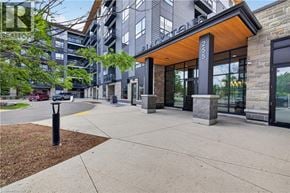 Waterloo condo for rent - The image shows a modern building entrance with a glass door and a wooden overhang.