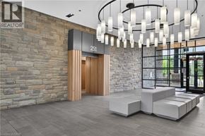 Waterloo condo for rent - A modern interior with a stone wall and a wooden door.