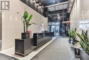 Toronto (Moss Park) condo for rent - A reception area with a sign that says "REALTOR" on the wall.