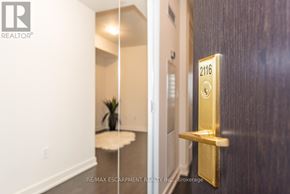 Toronto (Waterfront Communities) condo for rent - A golden door handle with the number 2116 on it.