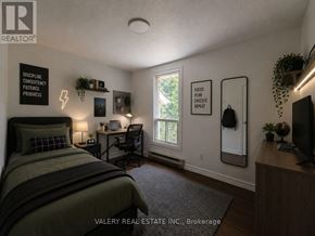 Guelph (Kortright East) apartment for rent - A bedroom with a bed, desk, and chair.