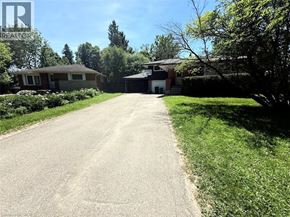 Waterloo apartment for rent - A residential area with a driveway leading to a house.
