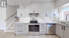 Toronto (Parkwoods-Donalda) apartment for rent - A kitchen with a stove top oven and a sink.