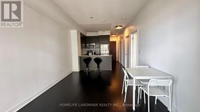 Mississauga (City Centre) condo for rent - A dining room with a table and chairs is shown.