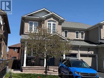 Mississauga (Hurontario) apartment for rent - A blue car is parked in front of a house.