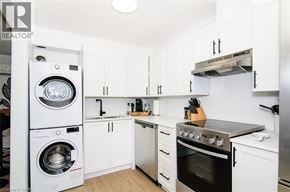Hamilton apartment for rent - A white kitchen with a washer and dryer built in.