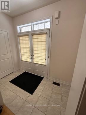 Brampton (Northwest Brampton) apartment for rent - A room with a door and a mat on the floor.