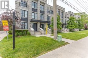 Mississauga (Mineola) townhouse for rent - A building with a sign in front of it that says "REALTORS".