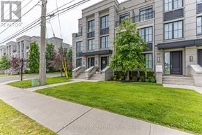 Mississauga (Mineola) townhouse for rent - A row of townhouses with a sidewalk in front.