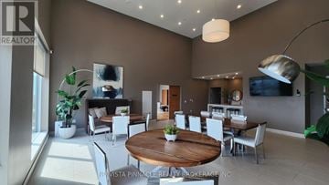 London East (East F) condo for rent - A modern living room with a wooden table and white chairs.