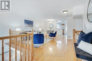 Ottawa townhouse for rent - A living room with a blue chair and a couch.