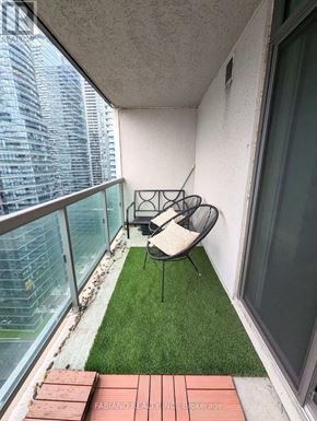 Toronto (Waterfront Communities) condo for rent - A balcony with a chair and a table.