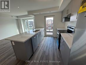 Brampton (Northwest Brampton) townhouse for rent - A kitchen with a large island and a view of the city.