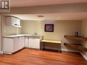 Mississauga (Churchill Meadows) townhouse for rent - A kitchen with white cabinets and a wooden floor.