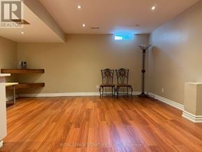Mississauga (Churchill Meadows) townhouse for rent - A room with wooden floors and a skylight.