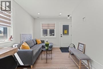 Windsor apartment for rent - A living room with a grey couch and a coffee table.