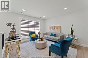 Windsor apartment for rent - A living room with a grey couch, a blue chair and a white coffee table.