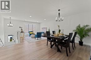 Windsor apartment for rent - A well-lit dining room with a wooden table and chairs.