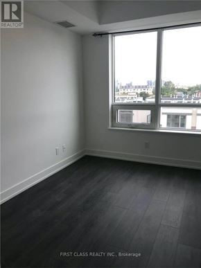 Markham (Unionville) condo for rent - A room with a large window and a view of the city.