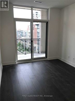 Markham (Unionville) condo for rent - A room with a sliding glass door leading to a balcony.