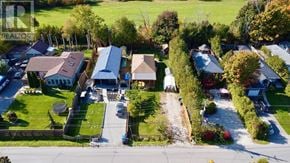 Innisfil apartment for rent - A large house with a driveway and a car parked in front.