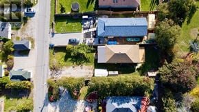 Innisfil apartment for rent - A bird's eye view of a residential area with houses and a street.