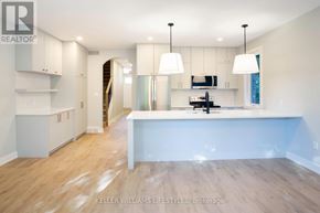 London South (South F) townhouse for rent - A spacious kitchen with white cabinets and a large island.