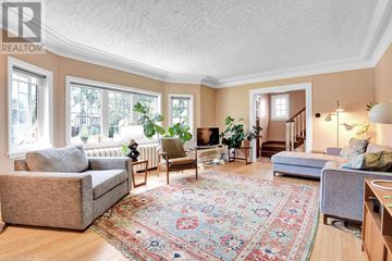 Ottawa apartment for rent - A living room with a rug on the floor and a couch.