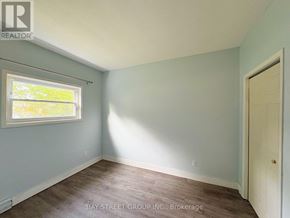 Fort Erie (Central) apartment for rent - A room with a window and a door is for sale.